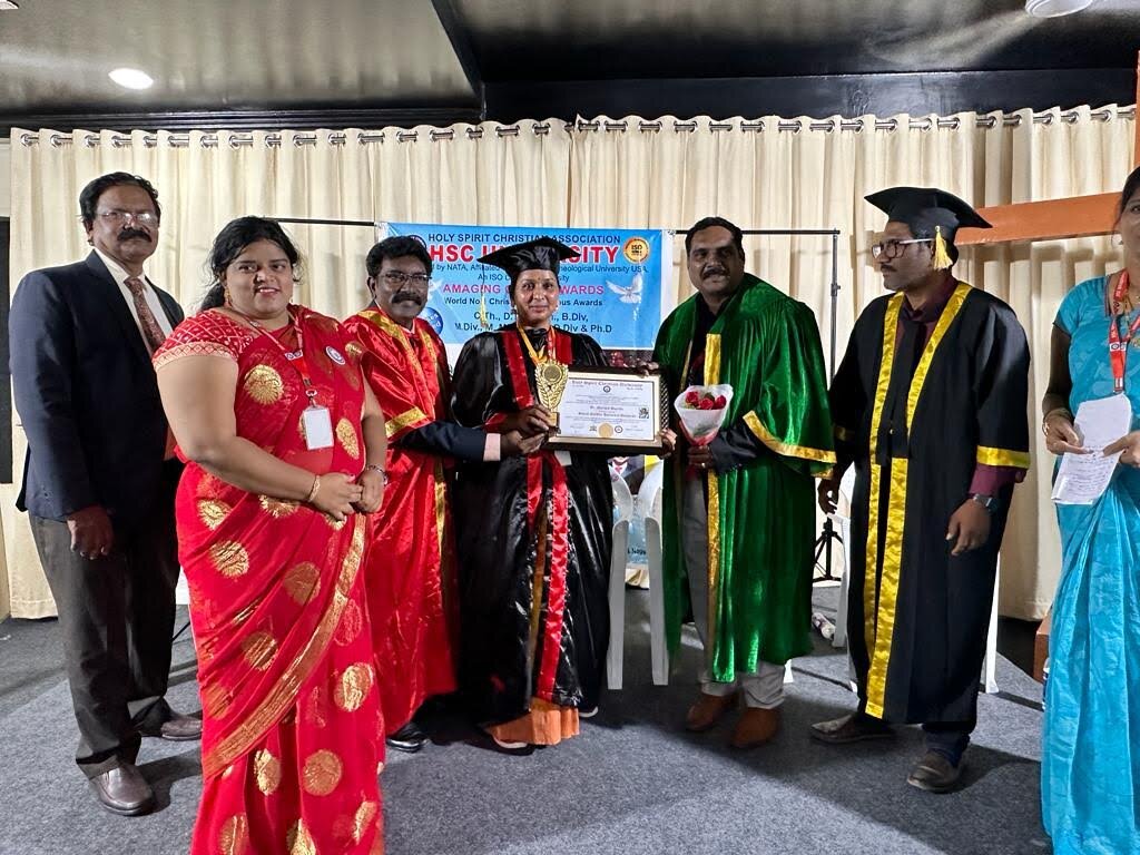 Award being presented on stage at an award ceremony